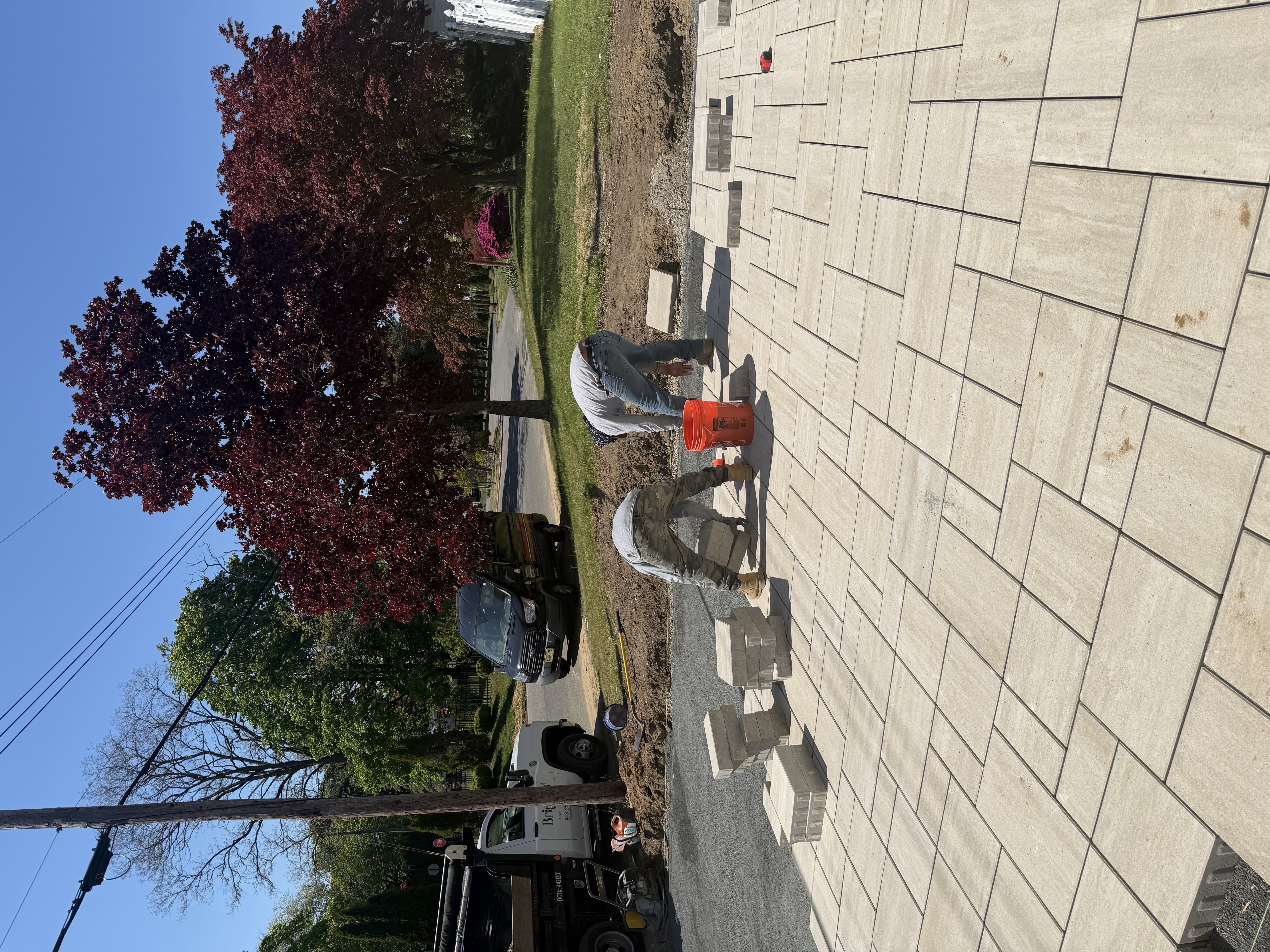 Crew laying pavers